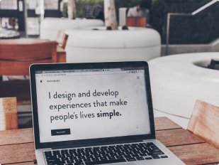 A laptop with a developer mission statement